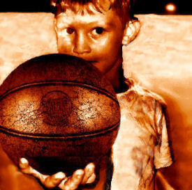 Kid with a vintage leather basketball